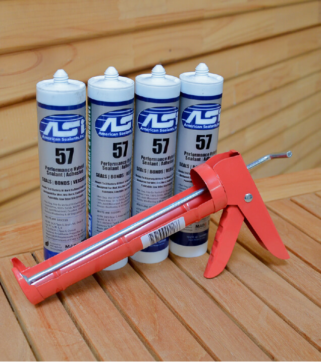4 caulk bottles with syringe