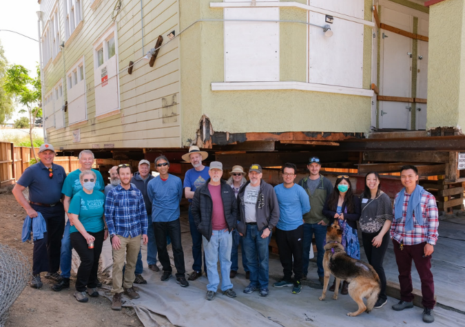 volunteers in front of building