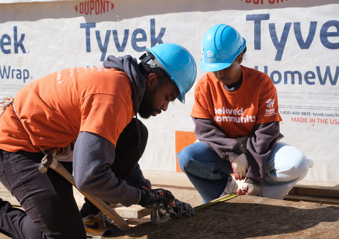 Volunteers building a roof