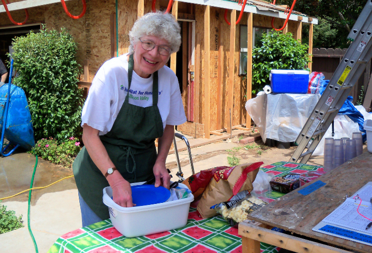 Ellen Hill preparing lunch on a construction site.