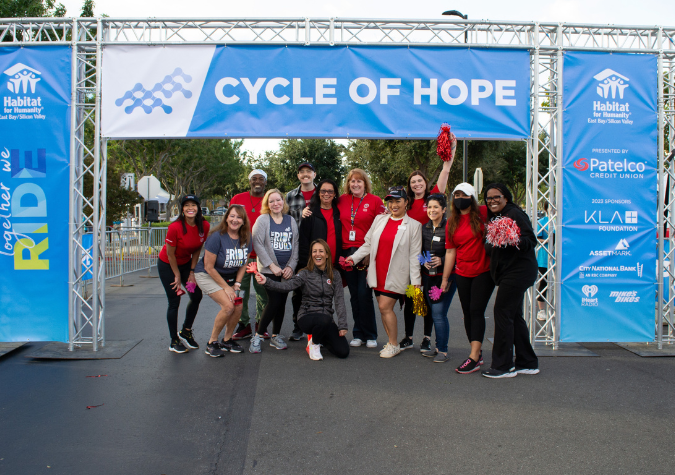 Patelco Volunteers in front of Habitat's Cycle of Hope startline.