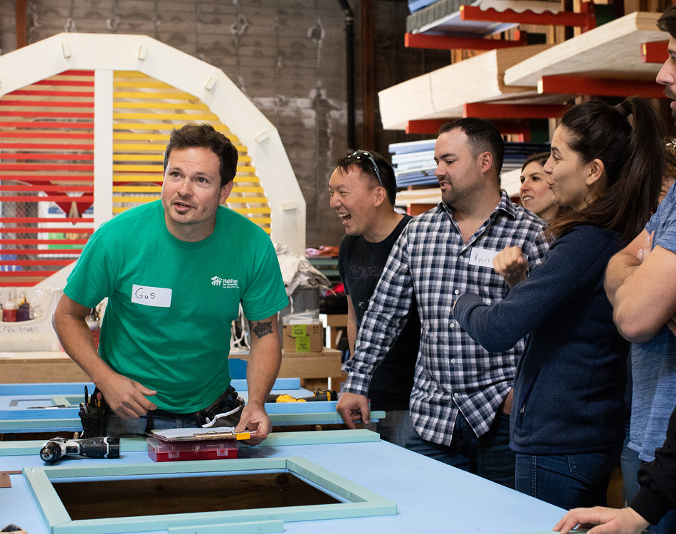 Group of volunteers building frames