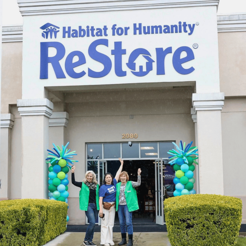 Restore Workers Standing Happy Outside a Restore location
