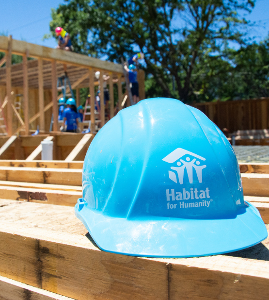 blue Habitat hard hat on construction site