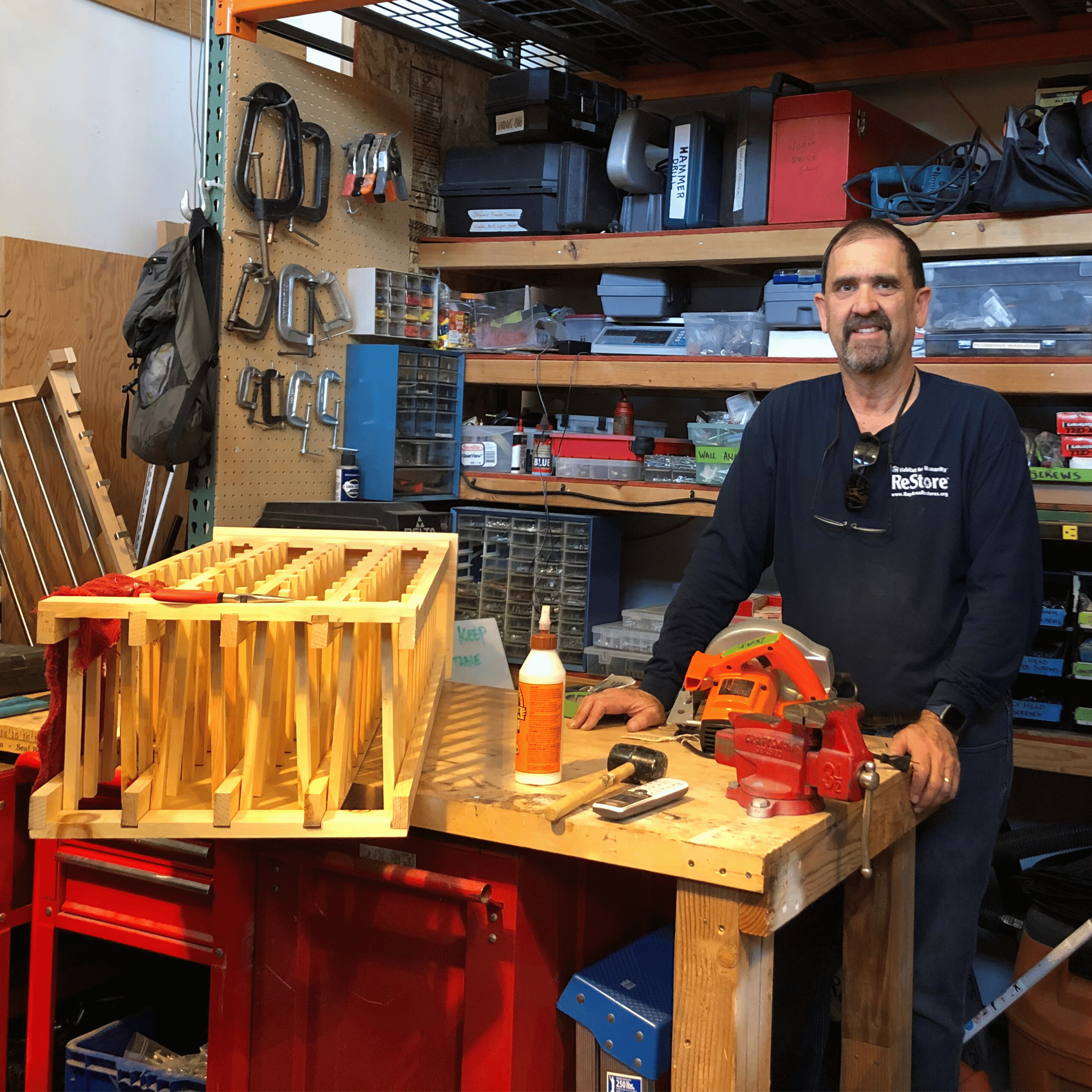 Volunteer Standing In A Workshop